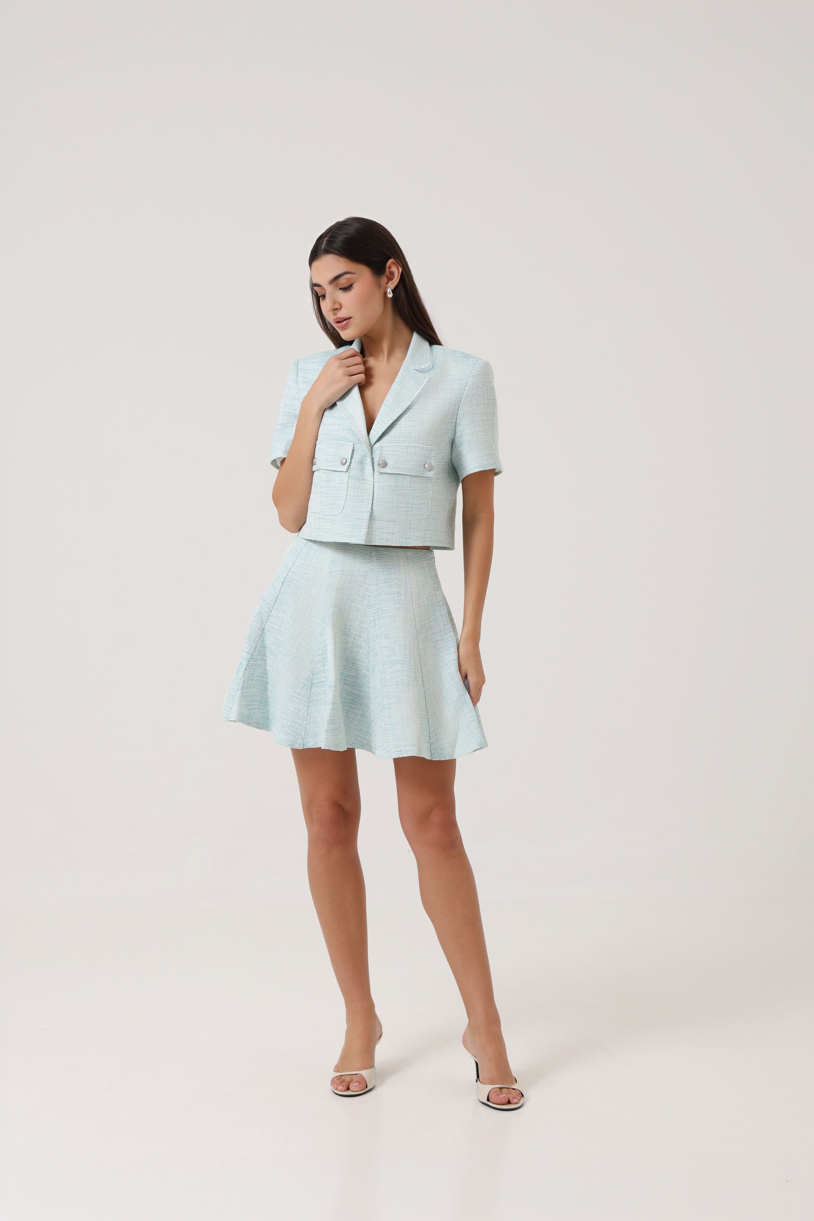 Model wearing the Portofino Mare Skirt by Rèmy Suits