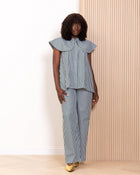 Full length front view of Kras the Label Navdar stripe co-ord set with wide-leg drawstring trousers
