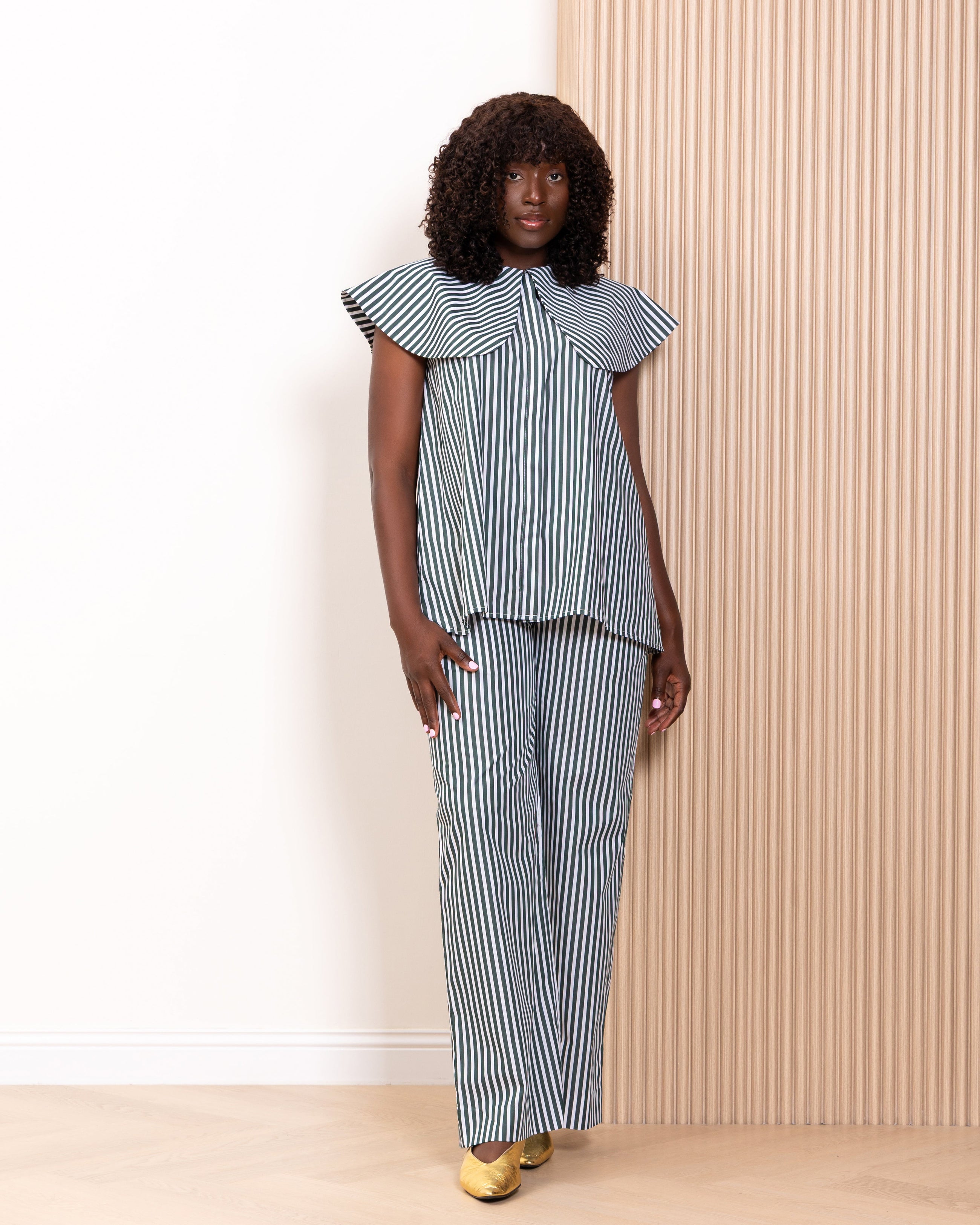 Full length front view of Kras the Label Navdar stripe co-ord set with wide-leg drawstring trousers