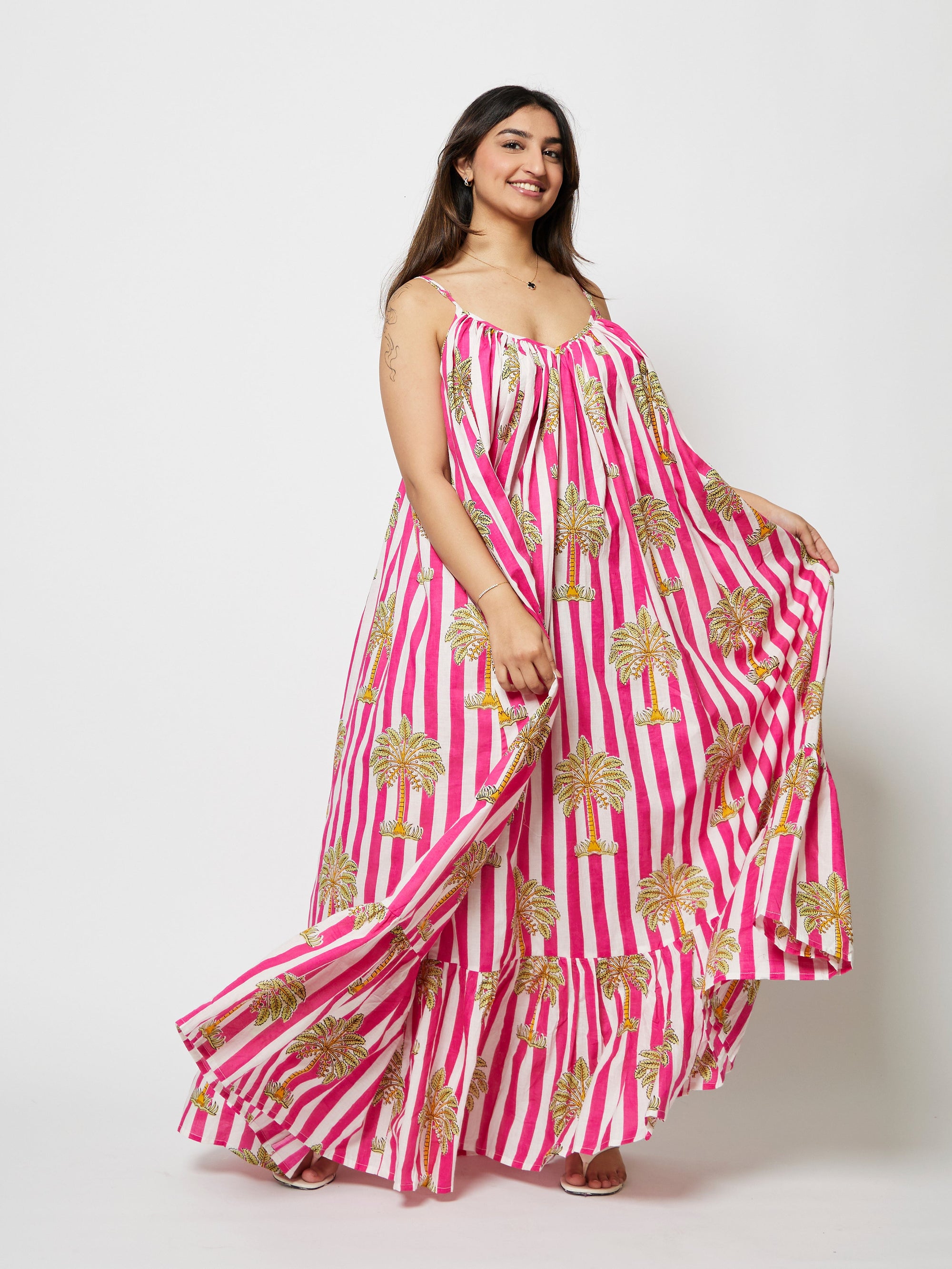 Model is wearing the Velora Maxi Dress by Kyshmysh 