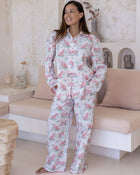 Layla Pink Long PJ Set – full-length front view of model standing and smiling in white long pyjama set with pink cheetah print, button-down shirt and wide-leg trousers
