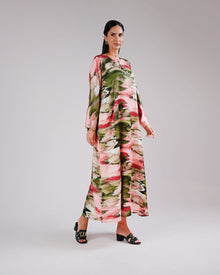 Full-length view of the Blossom Garden dress’s flowing botanical print.