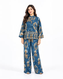 Model wearing the L’Artiste deep teal printed cotton shirt and matching wide-leg trousers