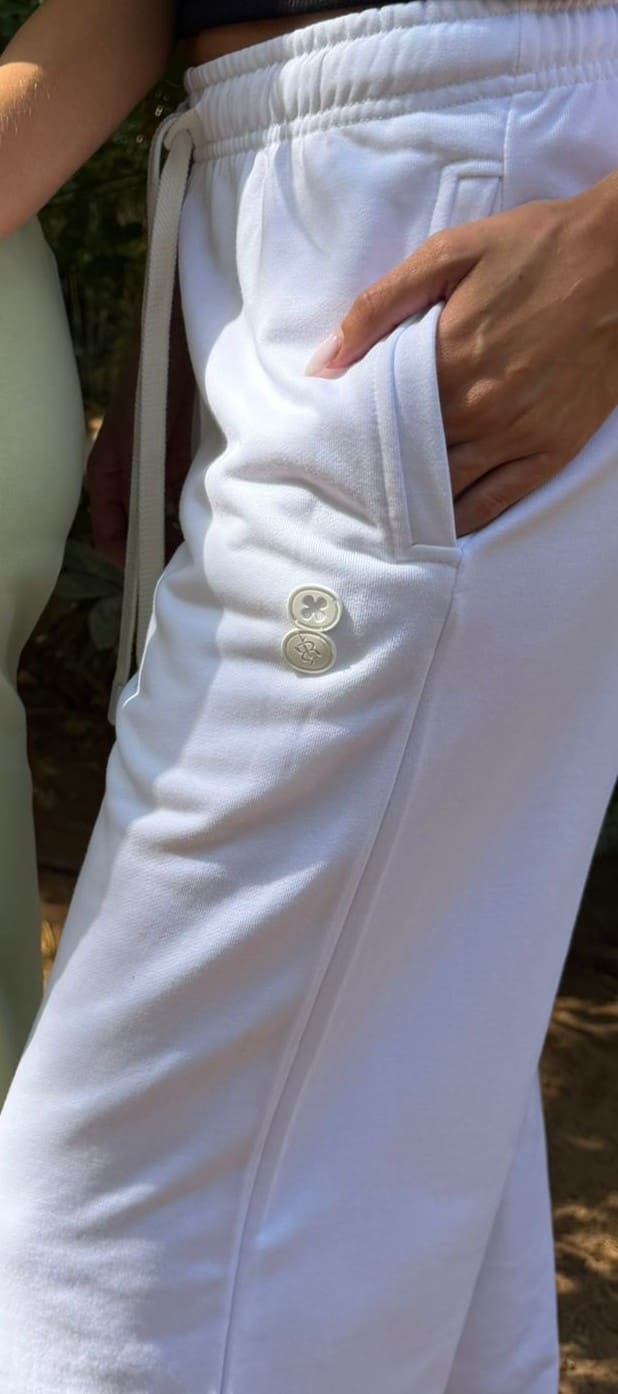 Close-up detail of the EOS X Remy White Joggers