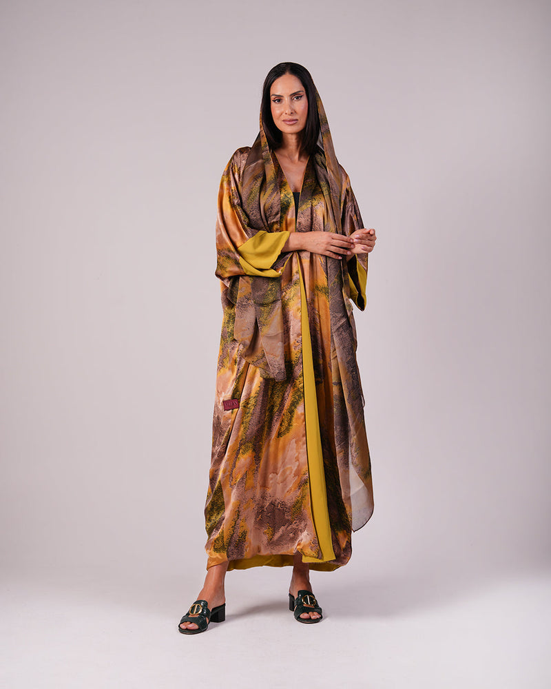 Full-length front view of the olive gold and bronze printed abaya with a matching headscarf.
