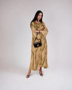 Full-length view of Mirelle olive and gold modest silk dress with A-line skirt