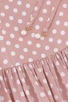 Close-up of the Hazar Azhari Polka Dot Tie Strap Maxi Dress showing the pearl-detailed shoulder straps and gathered skirt.