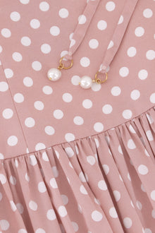 Close-up of the Hazar Azhari Polka Dot Tie Strap Maxi Dress showing the pearl-detailed shoulder straps and gathered skirt.