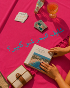 Close up shot of the Rio Embroidered Turkish Beach Towel in vibrant pink colour by Ashia
