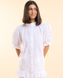 Front view of the Alma Gardenia Set, white button-down pyjama top with frilled cuffs and matching frilled shorts