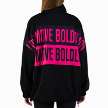 Black jacket with pink text on the back