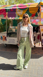 Model posing outside wearing the EOS X Remy Pistachio Joggers