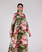 Model wearing the Blossom Garden silk dress in blush pink, rose and green.