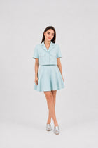 Model wearing the Ice Blue Skirt by  Rèmy Suits