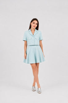 Model wearing the Ice Blue Skirt by  Rèmy Suits
