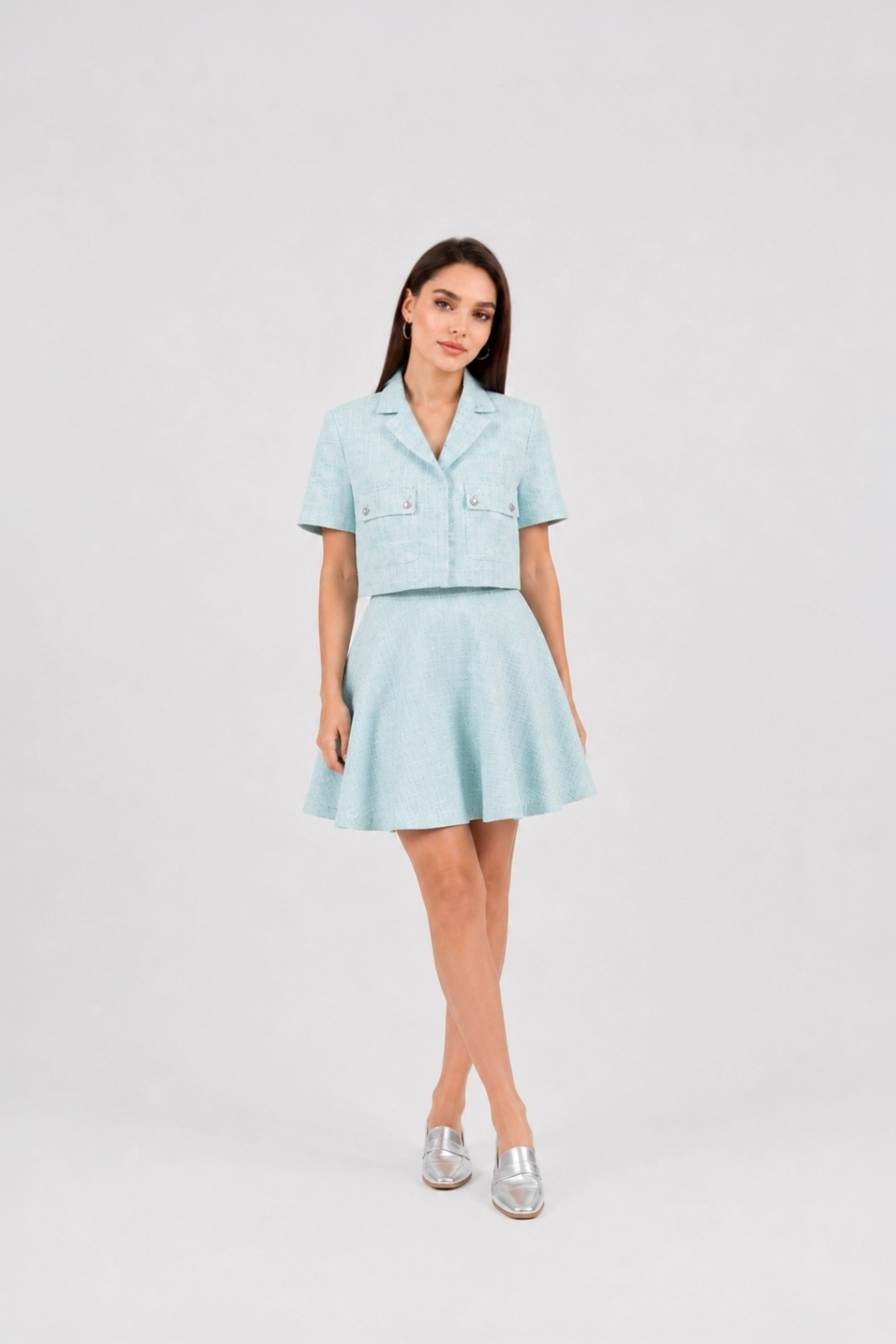 Model wearing the Ice Blue Skirt by  Rèmy Suits