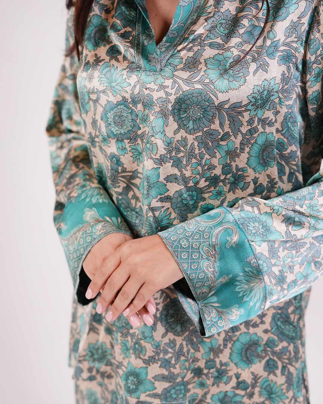 Close-up of the Soleia aqua blue and ivory print and sleeve cuff