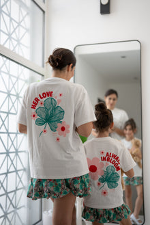 Back view of the EOS x Remy Bloom oversized white cotton T-shirt featuring the large floral graphic print
