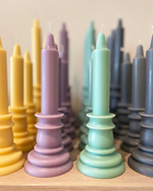 Close-up detail shot of the 3altawleh retro candles in various size and colours
