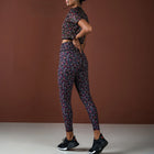 Person wearing a patterned athletic outfit on a brown background
