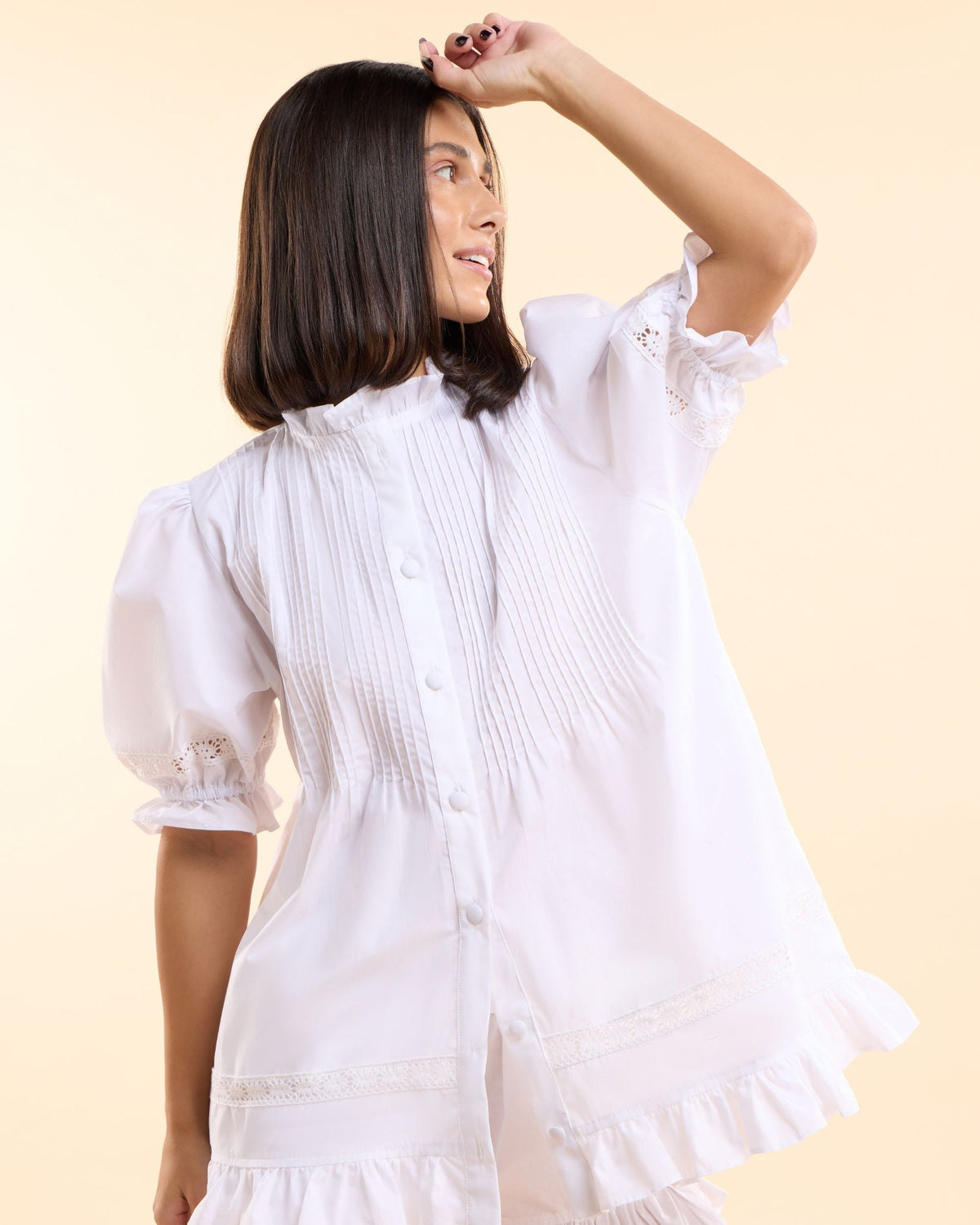 Alma Gardenia white cotton pyjama top with pin-tuck pleats, puff sleeves and ruffled hem, handmade in Dubai