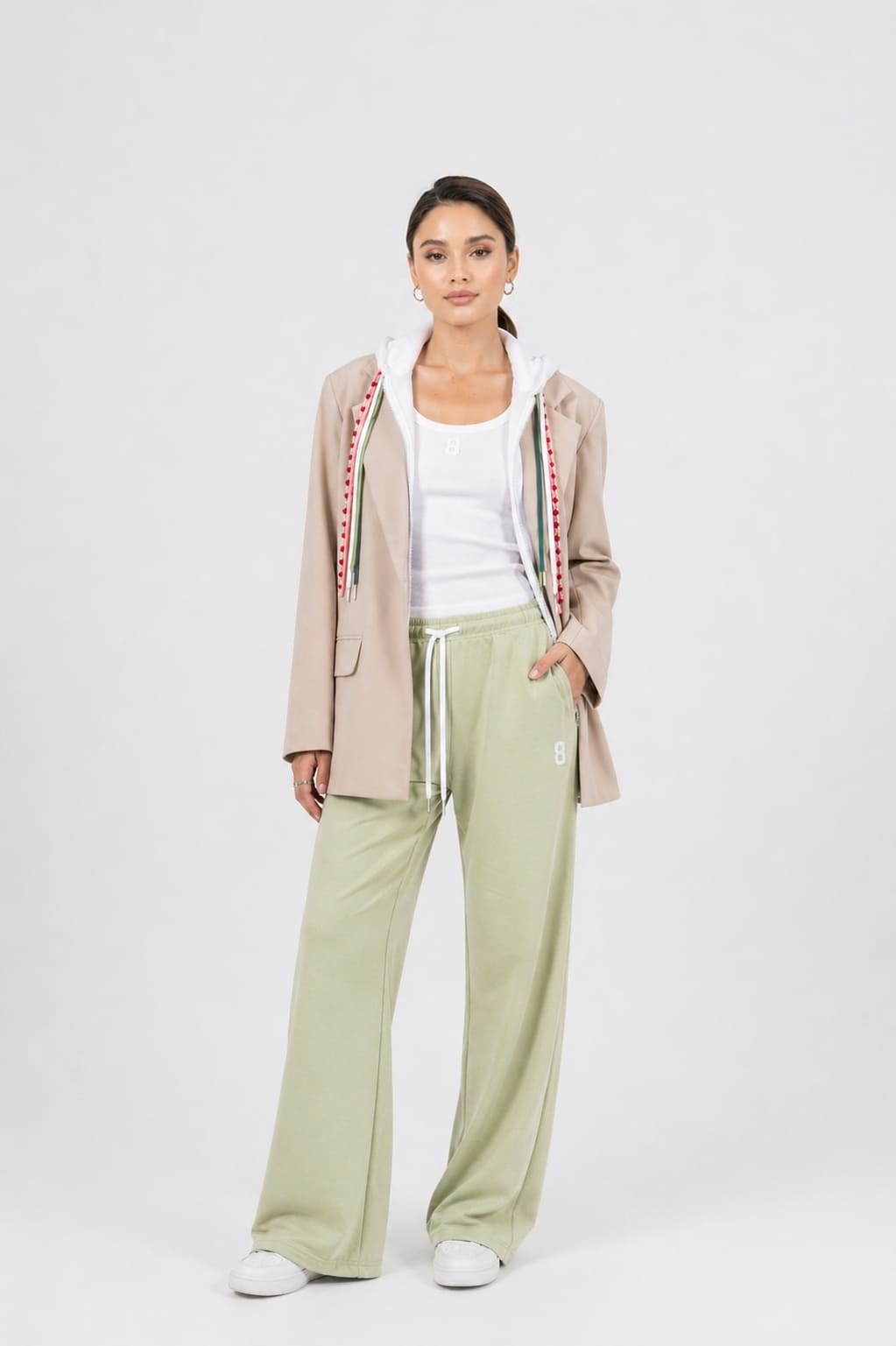 Model wearing the EOS X Remy collab joggers, tank top, and jacket 