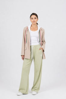 Model wearing the EOS X Remy collab joggers, tank top, and jacket 