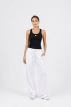 Model wearing the EOS x Remy Ribbed Tank Top and joggers