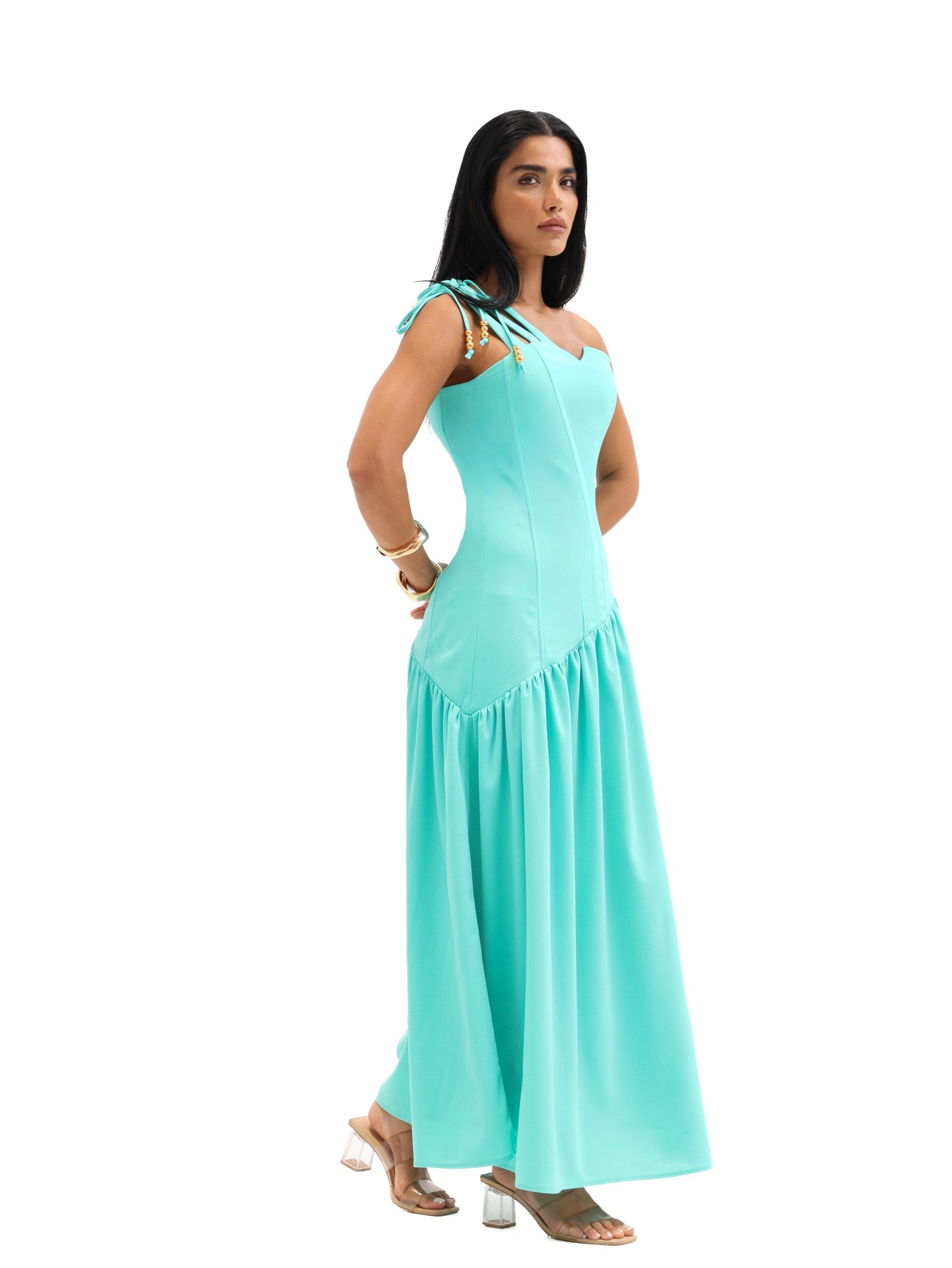 Side profile of model wearing the Maris Dress by Ragimora