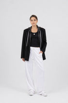 Model wearing the EOS x Remy Ribbed Tank Top, joggers, and jacket