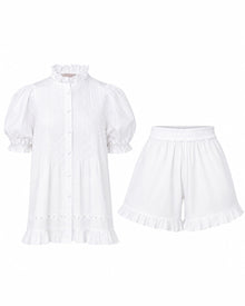 Alma Gardenia Set flat lay: white cotton pin-tuck top with frilled high collar and eyelet lace trim, with matching frilled shorts
