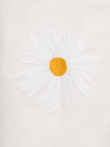 Daisy Embroidered Linen Shirt in White by Ashia — close up of daisy embroidery, UAE independent designer, Pose