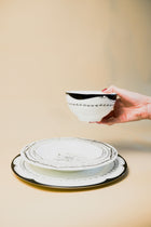 Hand holding the Palm Dinner Set by Doric Home