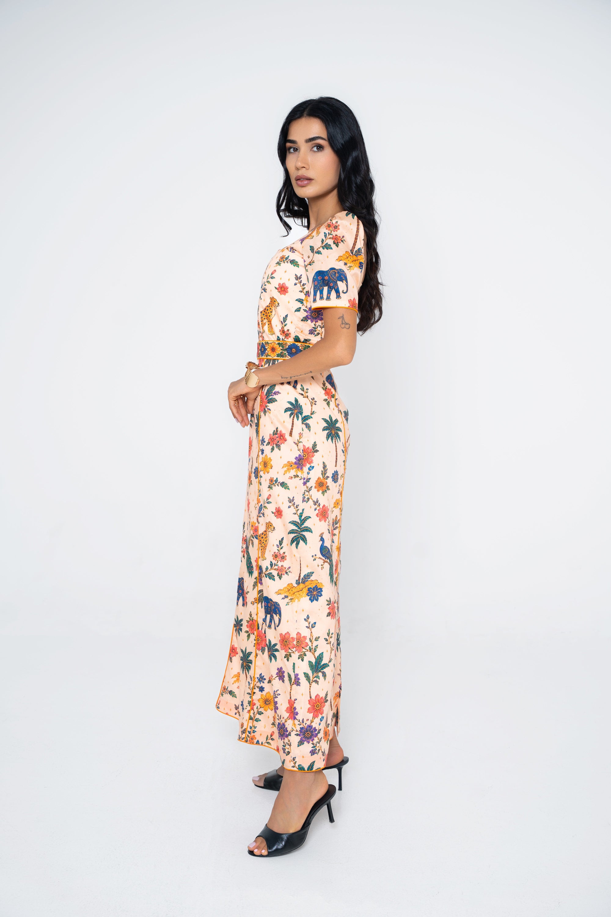 Side profile of model wearing the Savannah dress by Ragimora