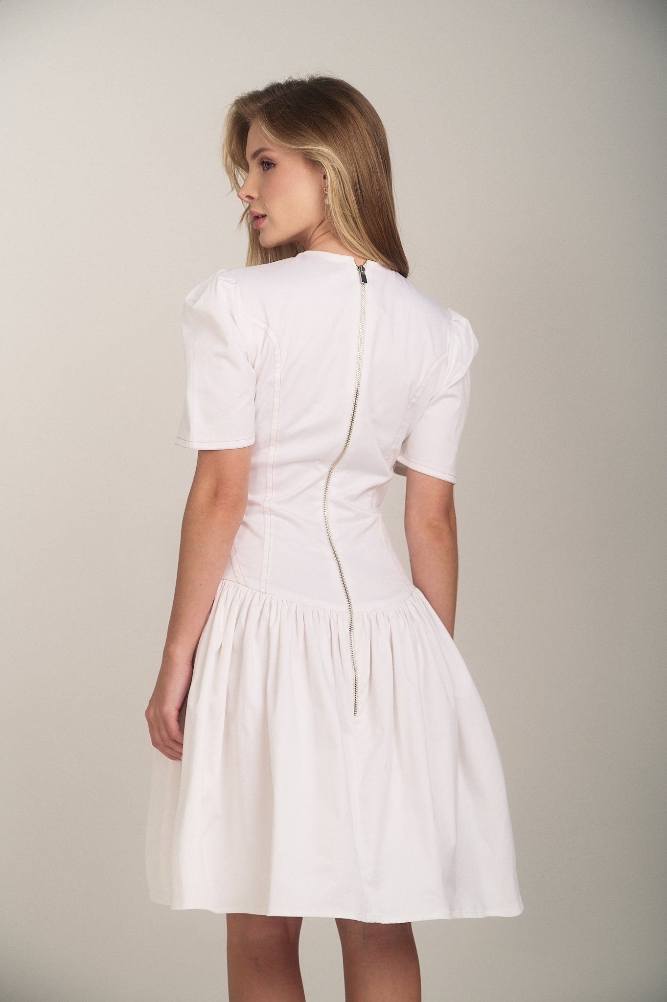 Back detail of the Contrast Stitch Drop Waist Mini Dress by Hazar Azhari 