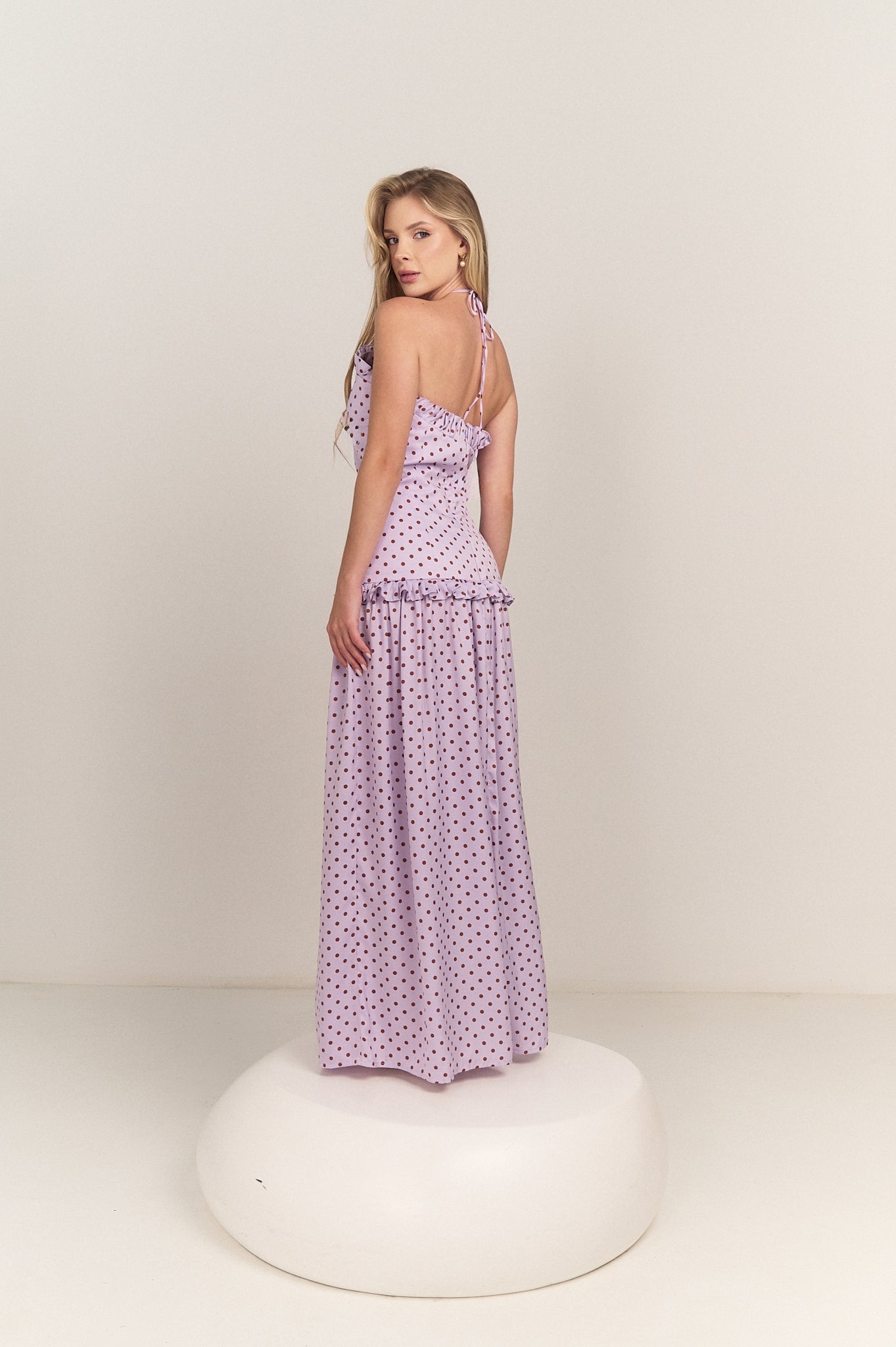 Side profile of the Ruffle Halter Polka Dot Maxi Dress by Hazar Azhari