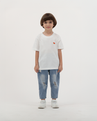 Boy wearing white Batikh Watermelon Print Kids T-Shirt with fruit design on back.