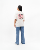 Female model in Jasmine Oversized Tee featuring jasmine flower artwork.