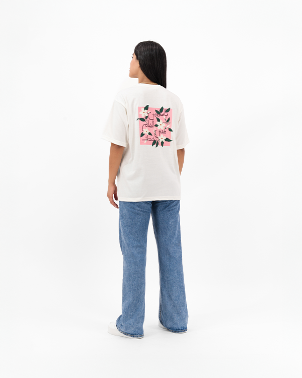 Female model in Jasmine Oversized Tee featuring jasmine flower artwork.