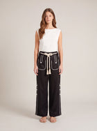 Model wearing the Aether Linen Trouser 