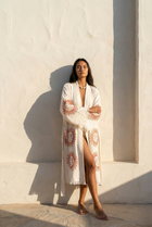 Model posing against the wall wearing the Hattusa Kimono by Zerla Studio