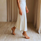 Model wearing the Sculpted Aura Gold Sandals