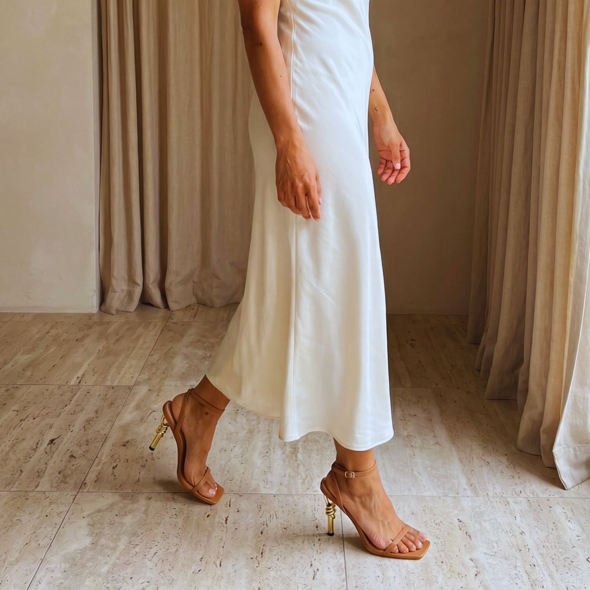 Model wearing the Sculpted Aura Gold Sandals