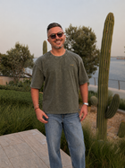 Model wearing the Olive Oversized T-shirt by Nabat and Hagat