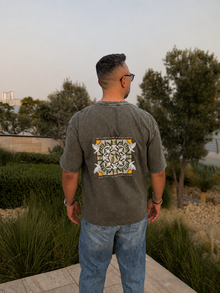 Male model wearing the Olive Oversized T-shirt by Nabat and Hagat