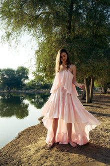 Model wearing the Hazar Azhari Cascading Ruffle Linen Maxi Dress.