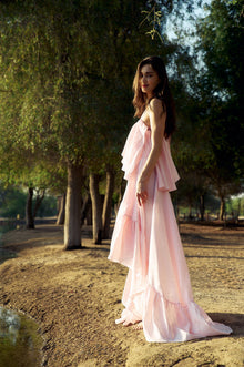 Side profile of model wearing the Cascading Ruffle Linen Maxi Dress