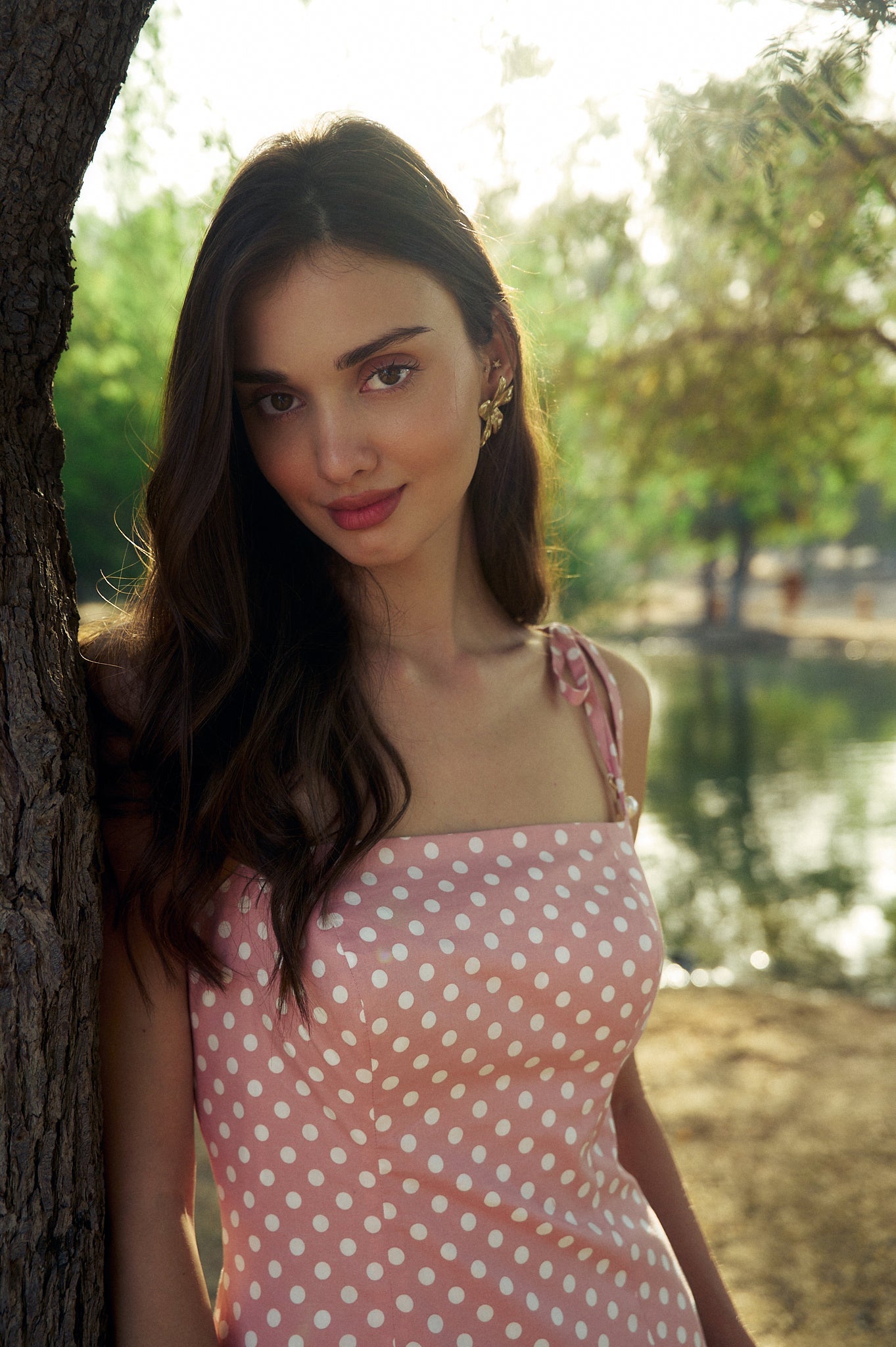 Model wearing the Hazar Azhari Polka Dot Tie Strap Maxi Dress with pearl-detailed shoulder straps.