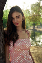 Model wearing the Hazar Azhari Polka Dot Tie Strap Maxi Dress with pearl-detailed shoulder straps.