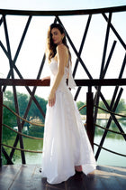 Model wearing the Halter Neck Cascading Ruffle Maxi Dress by Hazar Azhari 